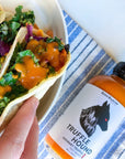 Truffle hound hot sauce on tacos